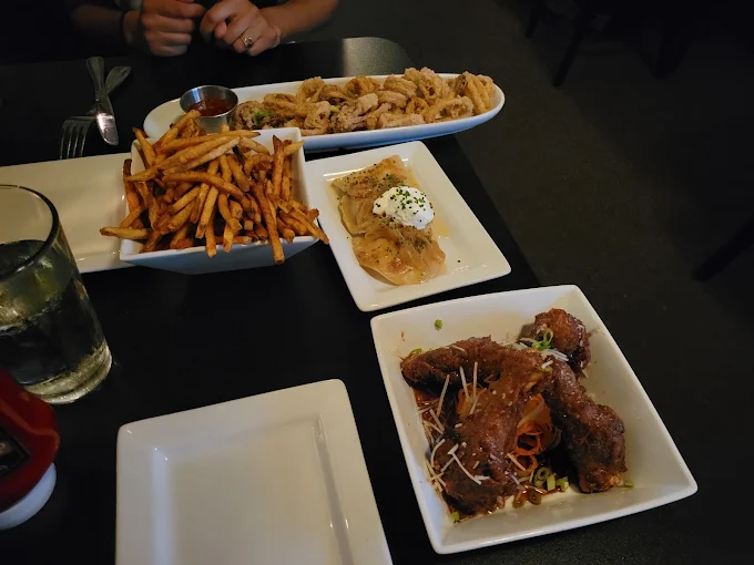 Shared plates and drinks at a Crush table